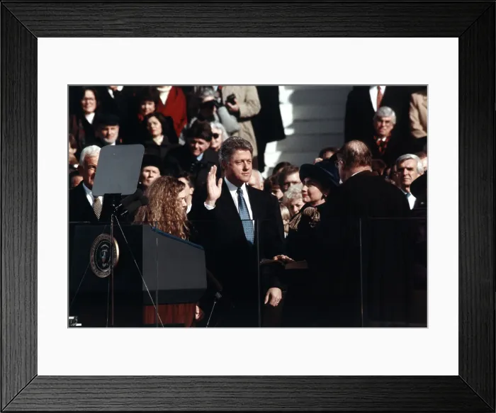 Framed Print : President Bill Clinton takes the oath of office administered by Chief Justice William Rehnquist. Wife Hillary Rodham Clinton and daughter Chelsea Clinton look on. Jan. 20, 1993