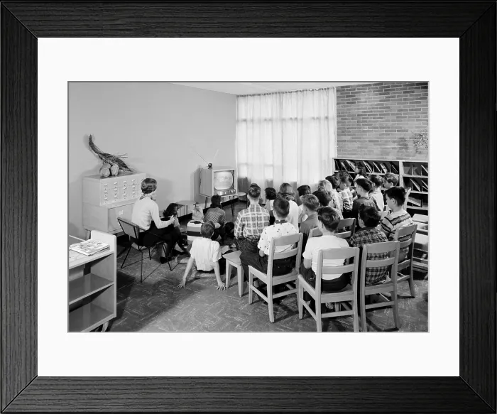 Framed Print : Students and their teacher watch educational television in a school library in Schenectady, New York, 1954