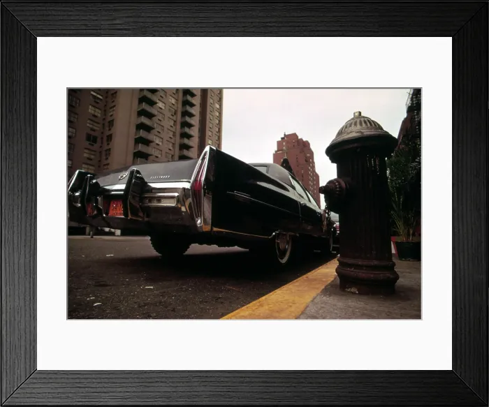 Framed Print : 1970s America. A Cadillac Fleetwood parked illegally in a fire lane. Manhattan, New York City, ca. 1973