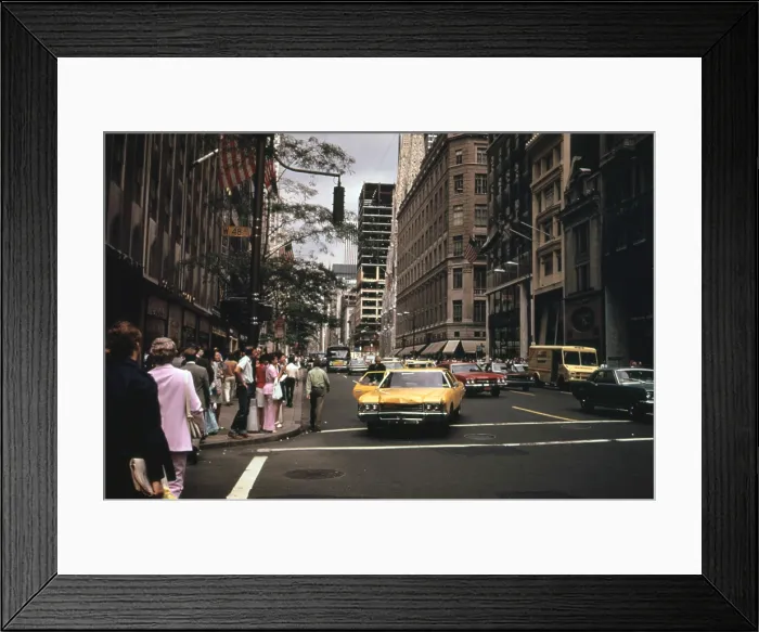 Framed Print : 1970s America. Yellow taxi cabs on the corner of 5th Avenue and 48th Street. Manhattan, New York City, ca. 1972