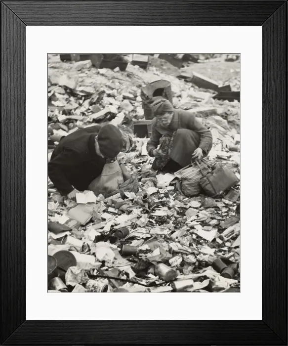 Framed Print : World War II, two Germans searching for food in a garbage dump, original caption: Hunger, the price of defeat, Berlin, Germany, photograph by Emil Reynolds, 1945