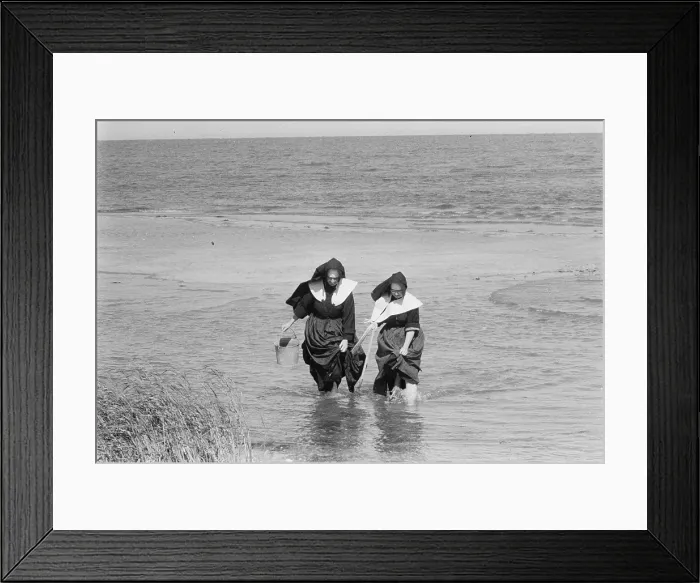 Framed Print : Nuns clamming on Long Island, New York, photograph by Toni Frissell, 1957