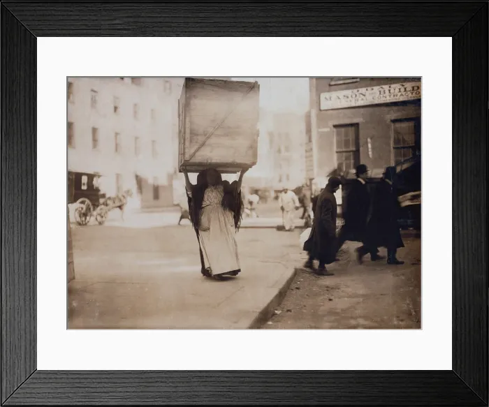 Framed Print : New York City, Italian woman carrying an enormous empty dry-goods box for along Bleeker Street, photograph by Lewis Wickes Hine, February, 1912
