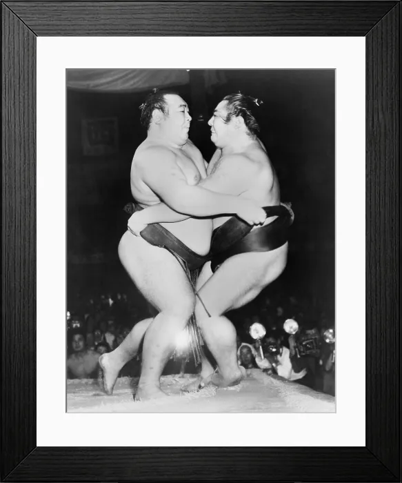 Framed Print : Champion Japanese Sumo wrestlers, Kiyoji Kagamisato (left) and Junnosuke Yoshibayama, in a 1952 Tokyo match
