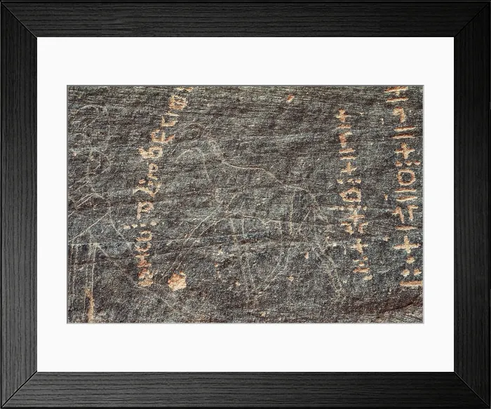 Framed Print : LIBYA. Tadrart Acacus. Rupestrian carving with reprsentation of a zoomorphic figure and inscriptions (12.000-8000 BC). Neolithic art. Petroglyph