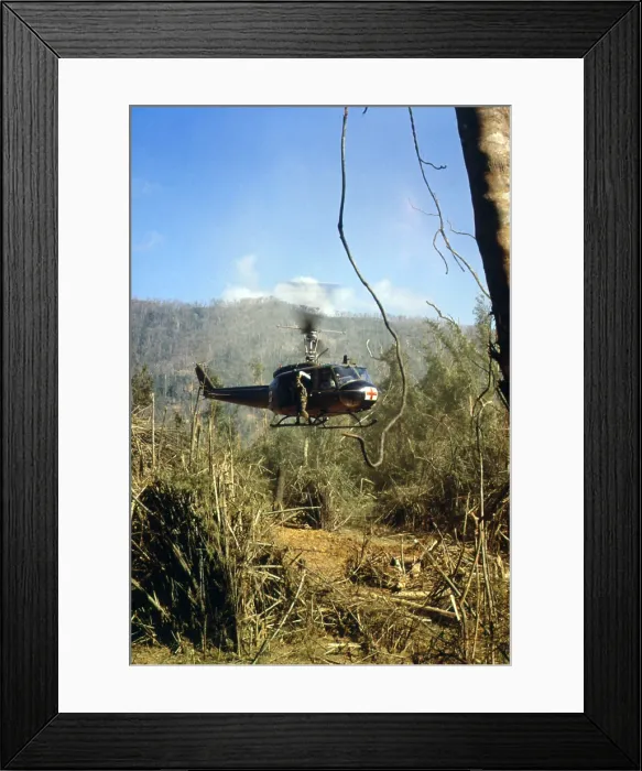 Framed Print : Vietnam War, South Vietnam, A UH-1D Medevac helicopter takes off to pick up an injured member of the 101st Airborn Division near the demilitarized zone, circa late 1960s