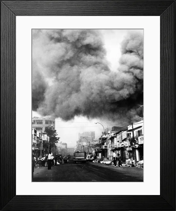 Framed Print : Vietnam War, black smoke over the capital city, fire trucks rush to scenes of fires set during the attacks by the Viet Cong during the Tet holiday period, Saigon, 1968