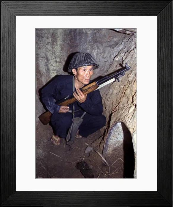 Framed Print : Vietnam War, a Viet Cong, soldier crouches in a bunker with an SKS rifle, circa late 1960s Framed Print : Vietnam War, a Viet Cong, soldier crouches in a bunker with an SKS rifle, circa late 1960s