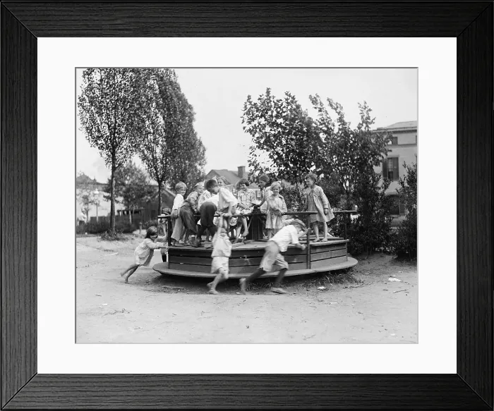 Framed Print : Children playing at a playground, circa 1918-1920