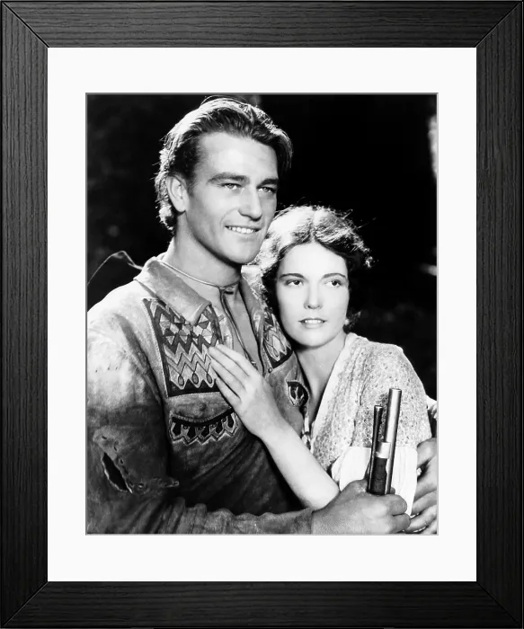 Framed Print : THE BIG TRAIL, from left, John Wayne, Marguerite Churchill, 1930, TM and Copyright 20th Century-Fox Film Corp. All Rights Reserved
