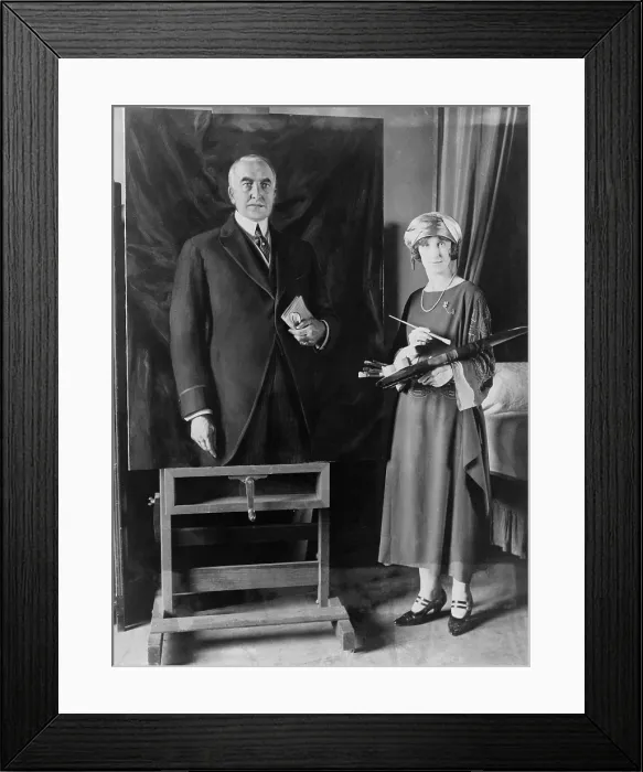 Framed Print : British artist, Margaret Lindsay Williams (1887-1960) stands beside her portrait of President Warren Harding