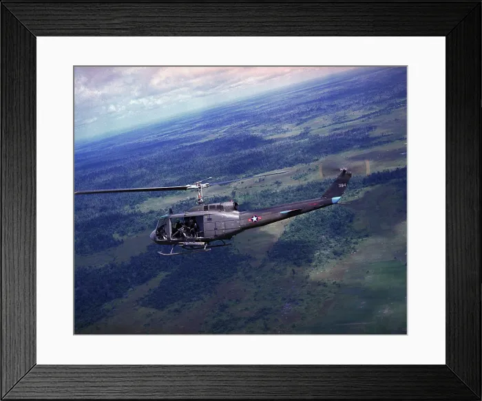 Framed Print : Vietnam War, side view of a Vietnamese Air Force UH-1H helicopter in flight over Southeast Asia, circa late 1960s Framed Print : Vietnam War, side view of a Vietnamese Air Force UH-1H helicopter in flight over Southeast Asia, circa late 1960s