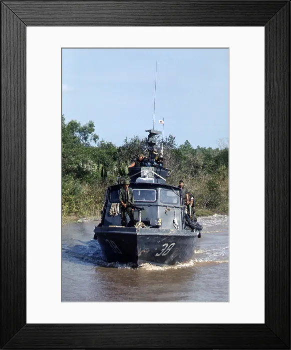 Framed Print : Vietnam War, U.S. Navy inshore patrol craft PCF-38 of Coastal Division 11 patrols the Cai Ngay Canal, circa 1960s