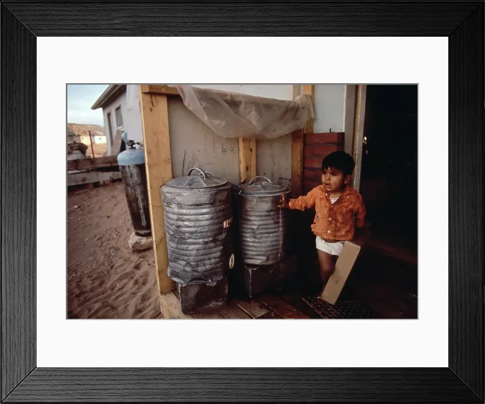 Framed Print : Native American reservation. A young boy in fornt of his home, which has no plumbing or electricty. Navajo Reservation, ca. 1973 Framed Print : Native American reservation. A young boy in fornt of his home, which has no plumbing or electricty. Navajo Reservation, ca. 1973