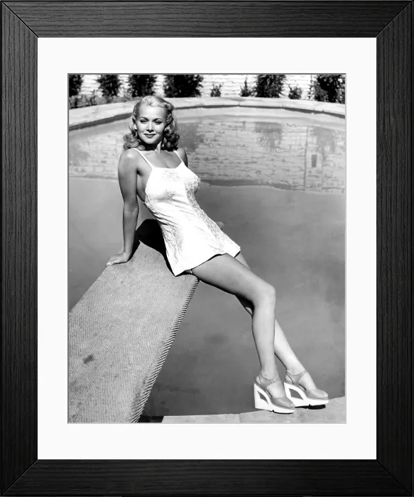 Framed Print : A GENTLEMAN AT HEART, Carole Landis, between scenes, 1942, TM and Copyright 20th Century Fox Film Corp. All rights reserved. Courtesy: Everett Collection