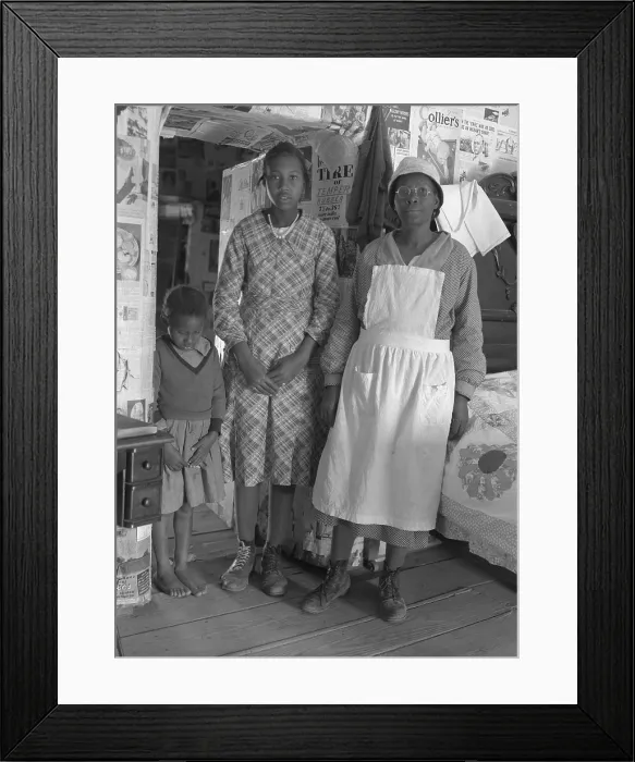 Framed Print : African American mother with her two daughters living in primitive conditions as plantation tenants in Gees Bend, Alabama