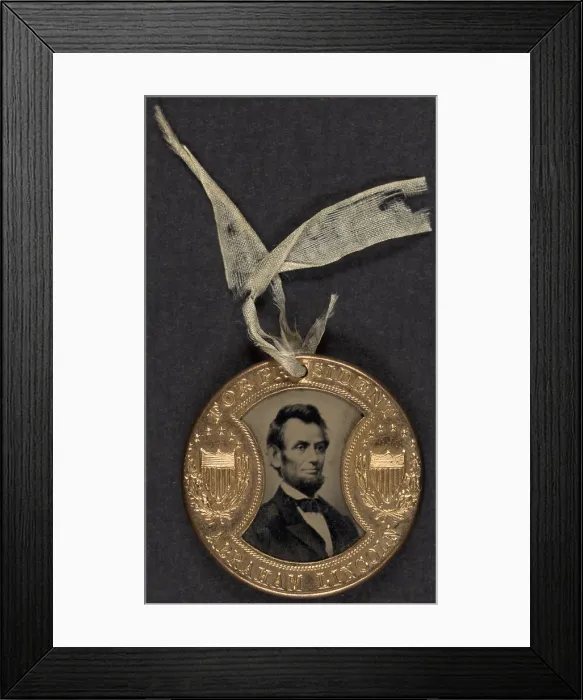 Framed Print : Campaign button for 1864 presidential election showing bust tintype portrait of Abraham Lincoln in a metal casing Framed Print : Campaign button for 1864 presidential election showing bust tintype portrait of Abraham Lincoln in a metal casing