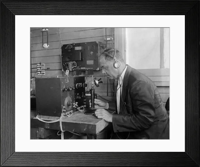 Framed Print : Technologist at the U.S. Naval Research Laboratory operating a telephone connected to electronic equipment. 1925