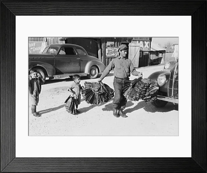 Framed Print : Creole trapper and his childen taking muskrat pelts into the FSA (Farm Security Administration) auction sale which is held in a dancehall on Delacroix Island, Louisiana