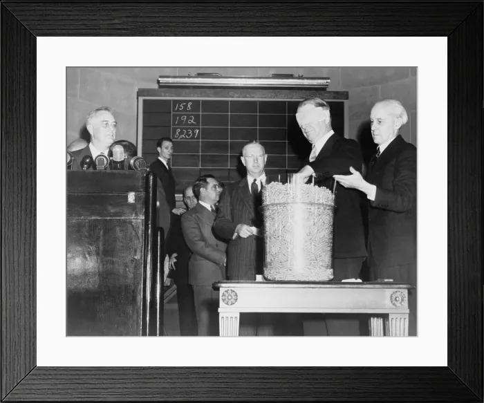 Framed Print : Secretary of Navy Frank Knox, blindfolded, drawing a number from the first peacetime military draft lottery in October 1940