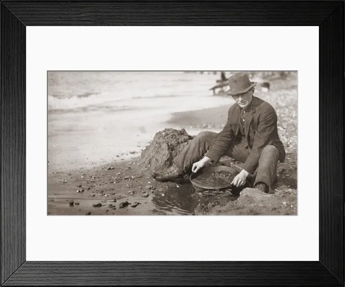 Framed Print : Man panning gold on Nome, Alaska, Beach in the early 20th century