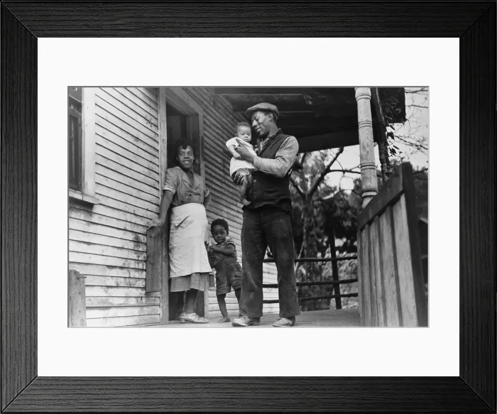 Framed Print : African American coal miner, his wife, and two of their children. The oldest child's bowed legs may be caused by rickets, a nutritional deficiency disease