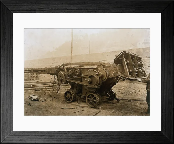 Framed Print : Machine used in a mine that digs the coal and loads it on the car, with it 3 men can do the work of 50 in the old way, yet they use boys to drive and trap, Gary, West Virginia