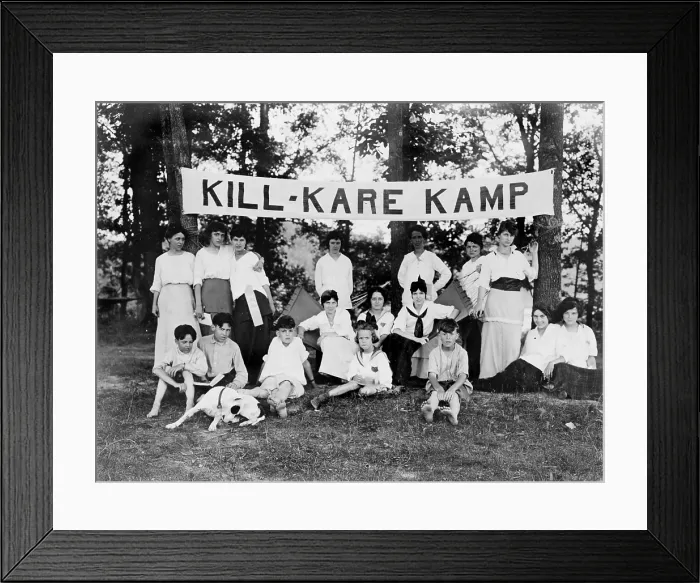Framed Print : Kill-Kare Kamp, boys and girls posed beneath a camp banner, photograph circa 1909-1932