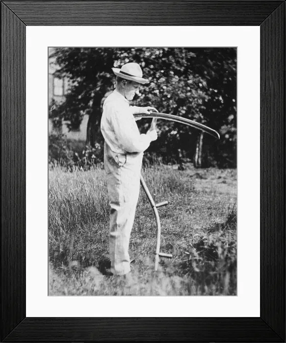 Framed Print : President Calvin Coolidge (1872-33) sharpening a scythe on his farm in Vermont