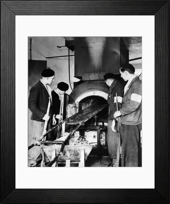 Framed Print : French soldiers examine the furnace used to burn dead prisoners at the Vosges concentration camp near Natzwiller, France, 1944. Courtesy: CSU Archives / Everett Collection