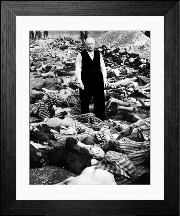 Framed Print : The commandant of the concentration camp in Landsberg, Germany stands amid some of the prisoners that were shot or burned as American soldiers approached, 1945 Framed Print : The commandant of the concentration camp in Landsberg, Germany stands amid some of the prisoners that were shot or burned as American soldiers approached, 1945