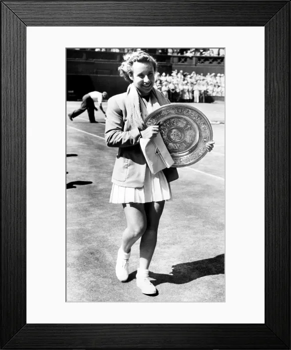 Framed Print : Maureen Connolly holds the 1952 Wimbledon trophy. Courtesy: CSU Archives / Everett Collection