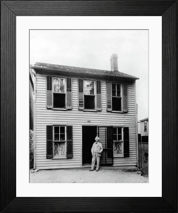Framed Print : MARK TWAIN in front of his boyhood home in Hannibal, Missouri. Undate photo.. Courtesy: CSU Archives / Everett Collection Framed Print : MARK TWAIN in front of his boyhood home in Hannibal, Missouri. Undate photo.. Courtesy: CSU Archives / Everett Collection