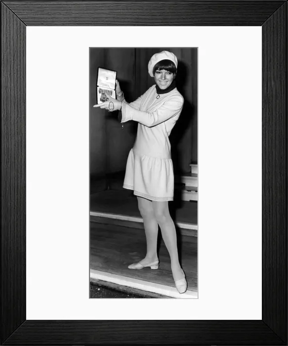 Framed Print : Mary Quant holding her Order of the British Empire medal, 1966. Courtesy: CSU Archives / Everett Collection
