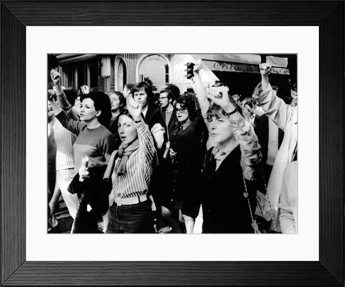 Framed Print : MARCHES-Men & women throw their arms in the air during a march through the streets of downtown Paris for popular government in France. 5 / 29 / 68