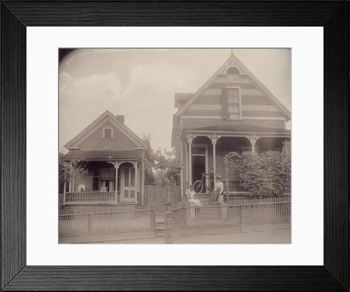 Framed Print : African American boy seated on porch of house, another African American boy standing with bicycle on porch of another house, with two young African American women on steps