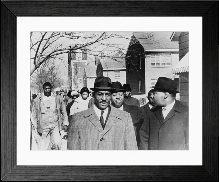 Framed Print : Fred Shuttlesworth (b. 1922) accompanied by Martin Luther King and Ralph Abernathy, leads a march for voter registration in Selma, Alabama in 1965. Rev