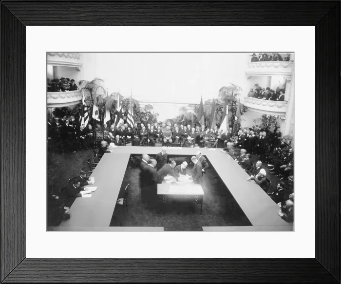 Framed Print : Secretary of State, Charles Evan Hughes (1862-1948), signing the treaties resulting from the Conference of Limitation of Armaments (Washington Naval Conference) on Feb 5, 1922