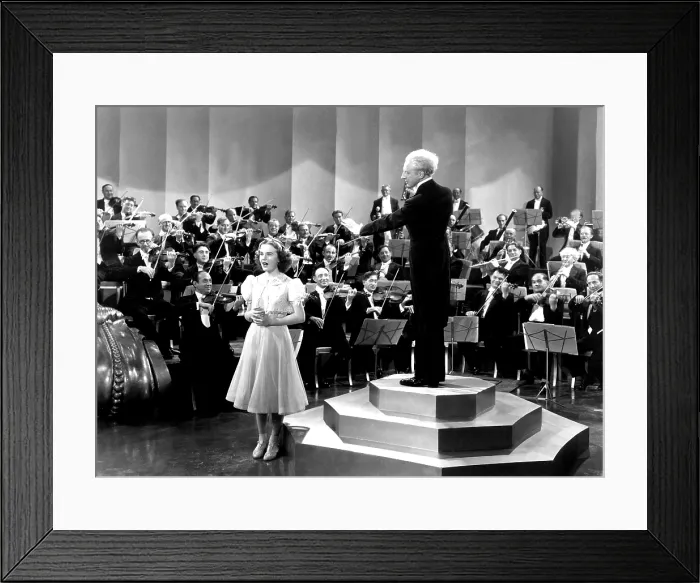 Framed Print : ONE HUNDRED MEN AND A GIRL, Deanna Durbin, Leopold Stokowski, 1937, singing with symphony orchestra Framed Print : ONE HUNDRED MEN AND A GIRL, Deanna Durbin, Leopold Stokowski, 1937, singing with symphony orchestra