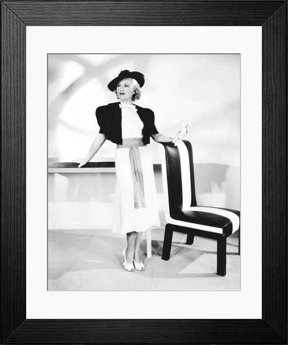 Framed Print : ONE MILE FROM HEAVEN, Claire Trevor in Spanish influenced semi-sports ensemble designed by Herschel, 1937, TM & Copyright 20th Century Fox Film Corp. / courtesy Everett Collection