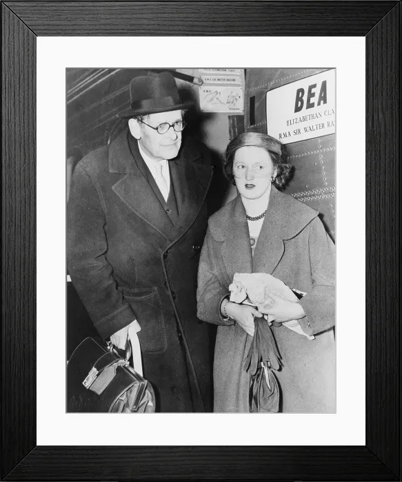 Framed Print : T.S. Eliot (1888-1965), American born English poet, and his wife, the former Miss Valerie Fletcher, arrive at London Airport from Nice after honeymoon in 1957