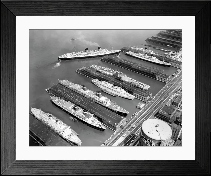 Framed Print : Luxury liners flanking an aircraft carrier at piers along the West Side Highway, from left to right: The Independence, The America, The United States, The Olympia, The U.S.S Framed Print : Luxury liners flanking an aircraft carrier at piers along the West Side Highway, from left to right: The Independence, The America, The United States, The Olympia, The U.S.S