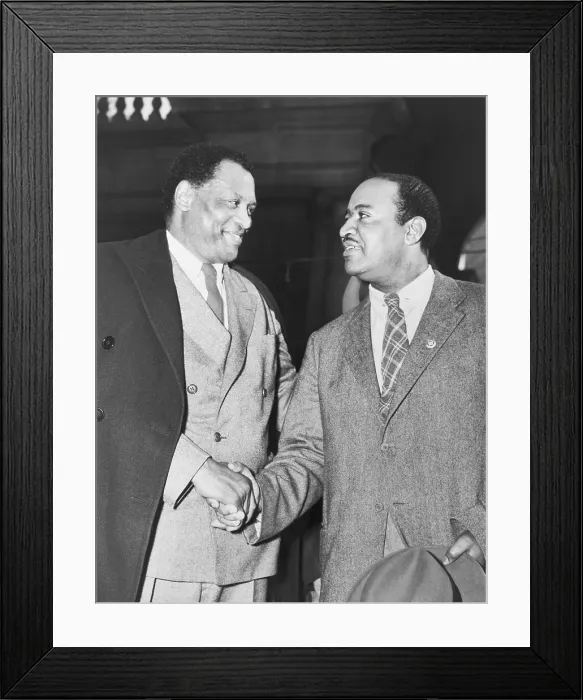 Framed Print : Paul Robeson (1898-1976), shaking hands with New York City Councilman Ben Davis (1903-1964), in Union Square during May Day ceremonies in 1947 Framed Print : Paul Robeson (1898-1976), shaking hands with New York City Councilman Ben Davis (1903-1964), in Union Square during May Day ceremonies in 1947