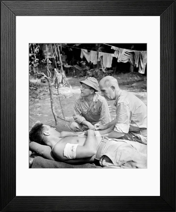 Framed Print : Blood Transfusion. A wounded man behind the lines on the Buna front being given a blood transfusion. Buna, New Guinea. 1942
