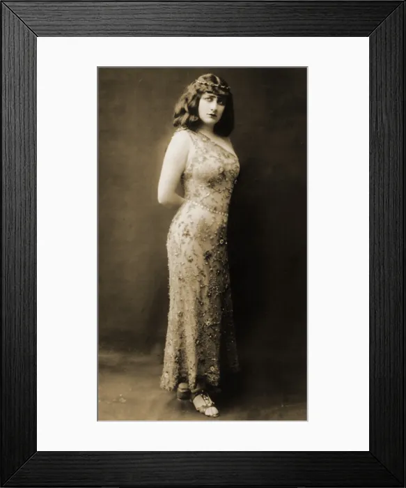 Framed Print : Mary Garden (1877-1967), as the pagan courtesan Thais, in a skin tight sequined gown, for the 1909 production of the opera by Jules Massenet Framed Print : Mary Garden (1877-1967), as the pagan courtesan Thais, in a skin tight sequined gown, for the 1909 production of the opera by Jules Massenet