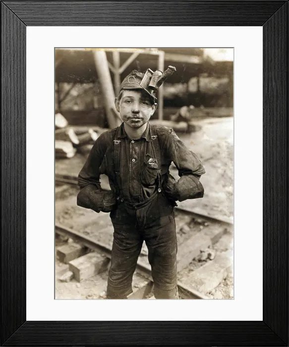 Framed Print : Child laborer portrayed by Lewis Hine in 1908. Tipple Boy at West Virginia coal mine, worked with the tipple, a device that tilted coal cars from the mine for unloading