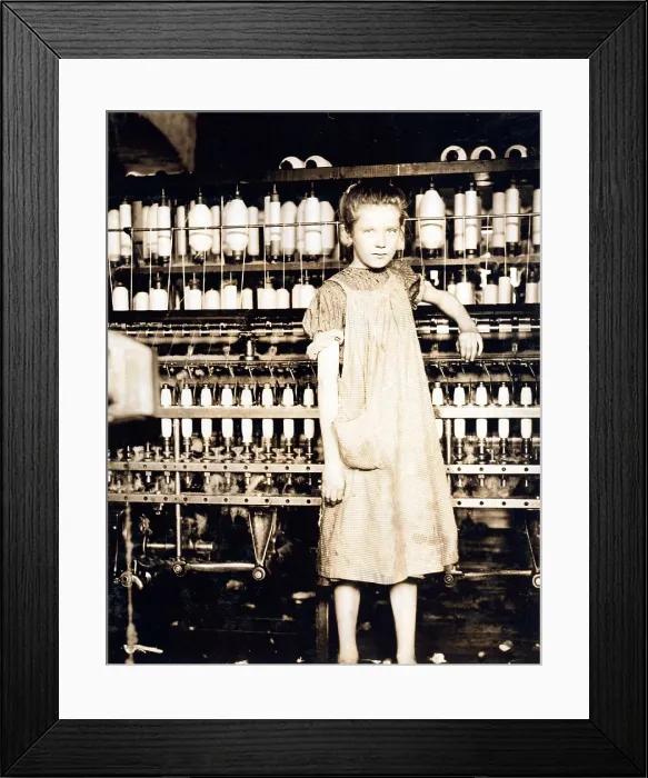 Framed Print : Child laborer portrayed by Lewis Hine in 1910. Twelve year old Addie Card, was a spinner in a Vermont cotton mill, and did not plan to go back to school