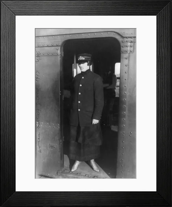 Framed Print : New York City, woman subway worker standing in subway doorway, New York, photograph, 1917