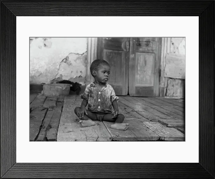 Framed Print : African American child on a dilapidated porch, original title: Negro child on porch of dilapidated Trepagnier plantation near Norco, Louisiana