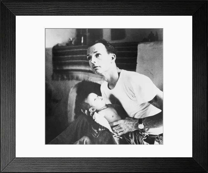 Framed Print : Dr. Thomas A. Dooley (1927-1961) examining an ill child at a hospital in northern Laos Framed Print : Dr. Thomas A. Dooley (1927-1961) examining an ill child at a hospital in northern Laos